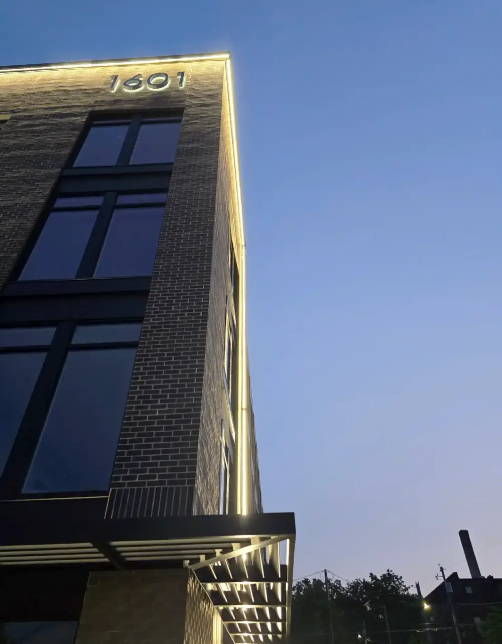 Lighting outside the High Street Lofts building in Des Moines shines at night